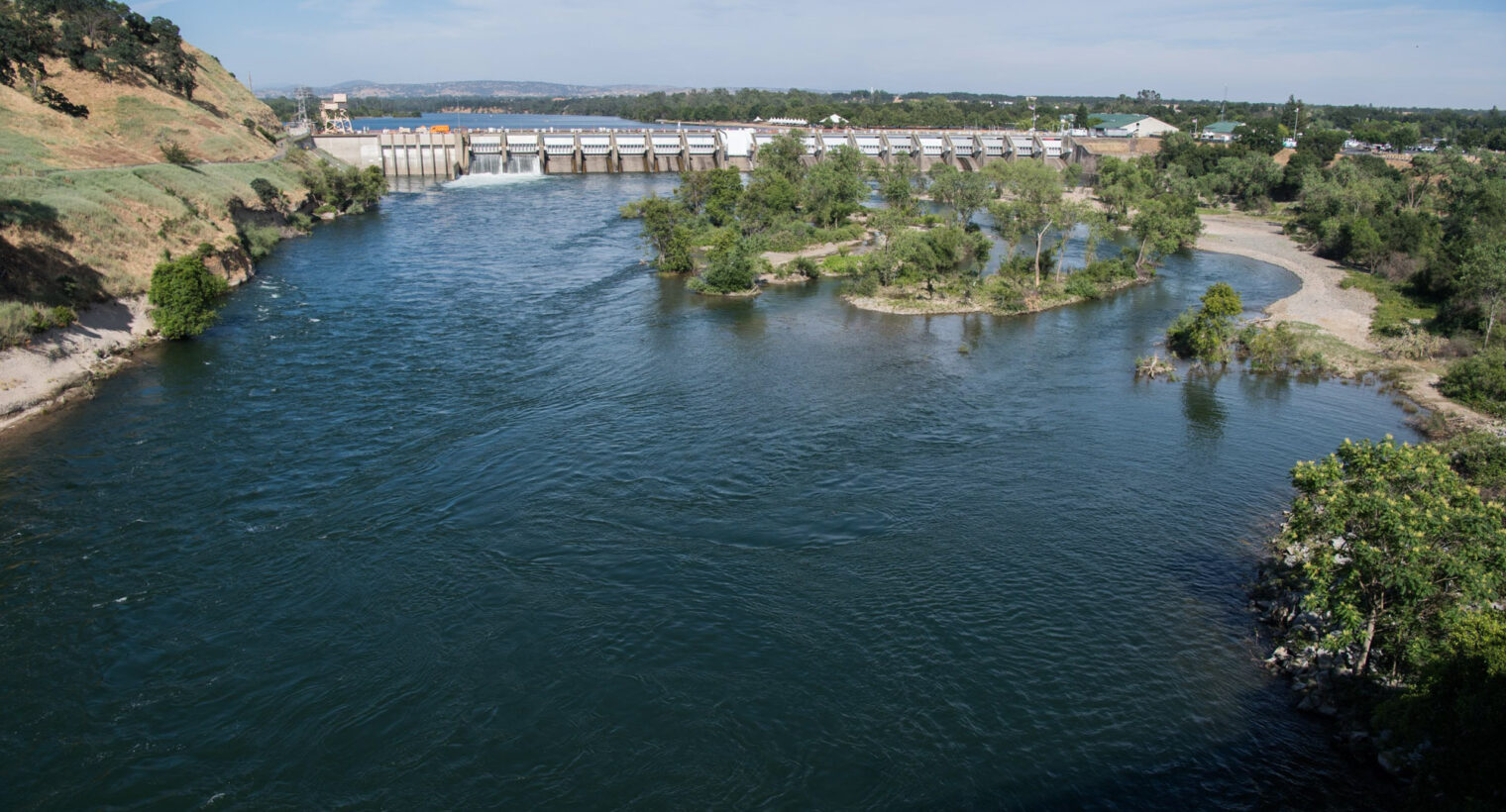 Photo shows Nimbus Dam on the American River, CA.